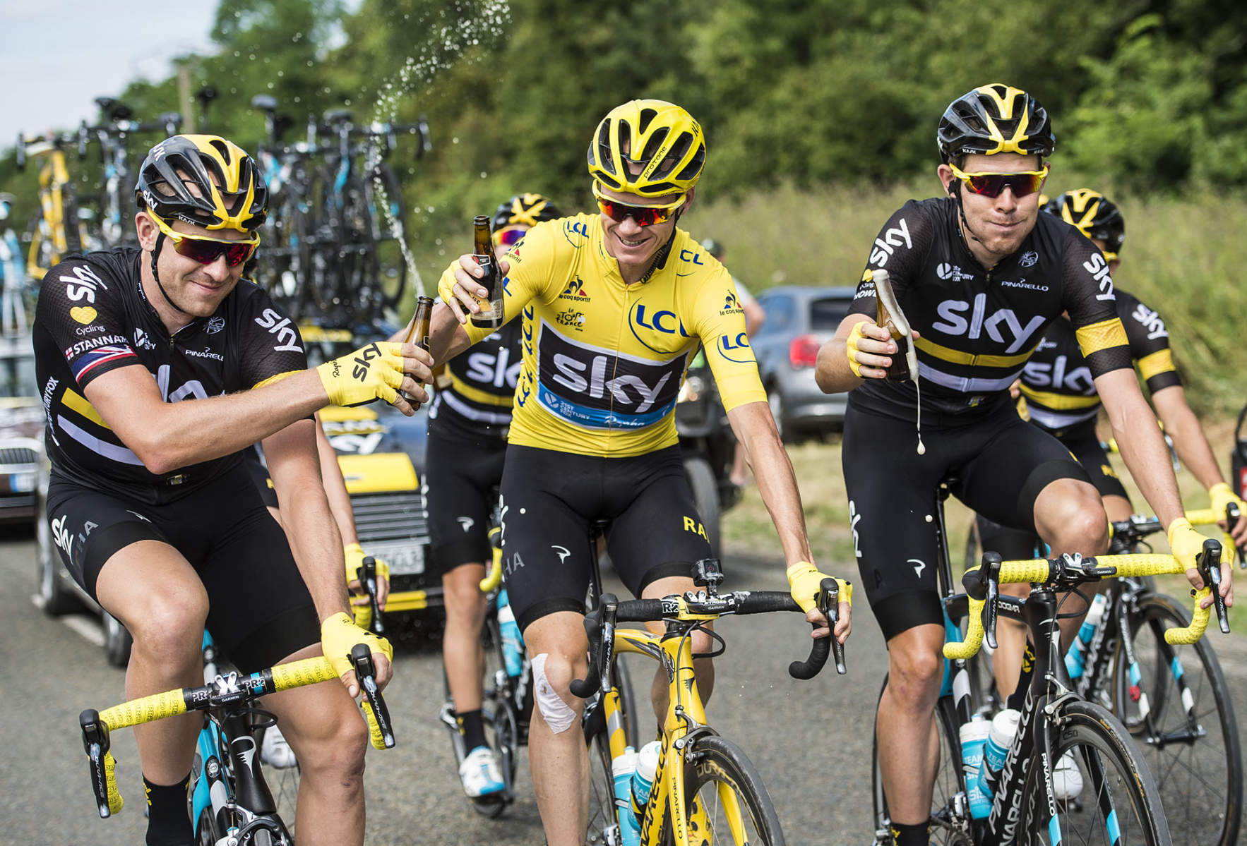 Tour de France 2016 - Stage Twenty One - Chris Froome celebrates with Ian Stannard and Luke Rowe